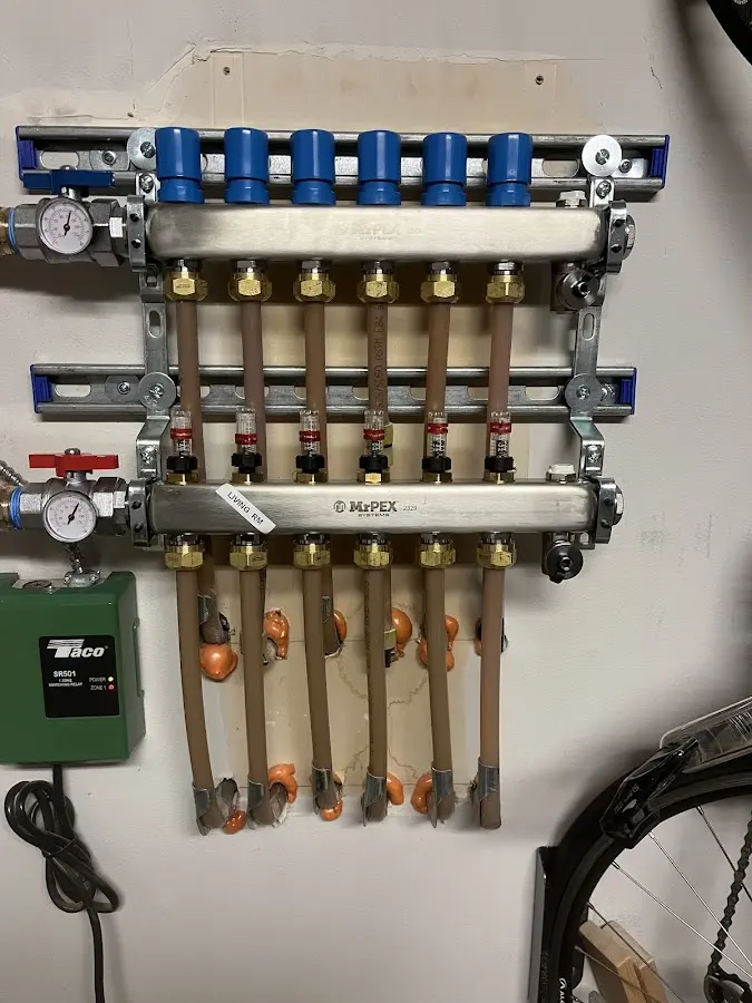 Plumber performing Water Heater Repair at a residential property in Staples